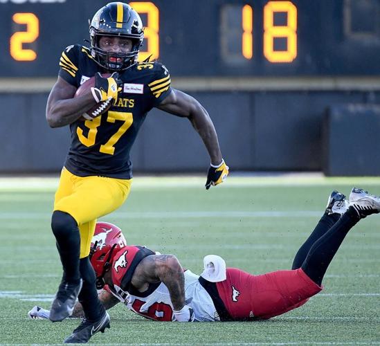 Tiger-Cats Secure DB Woods III, LB Makonzo, and DL Watkins